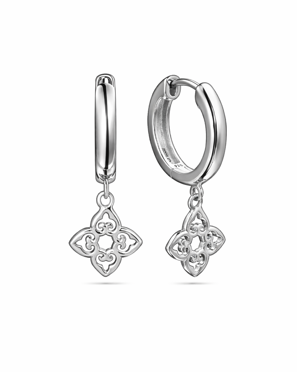 Silver hoop earrings with clover-shaped charms on a white background