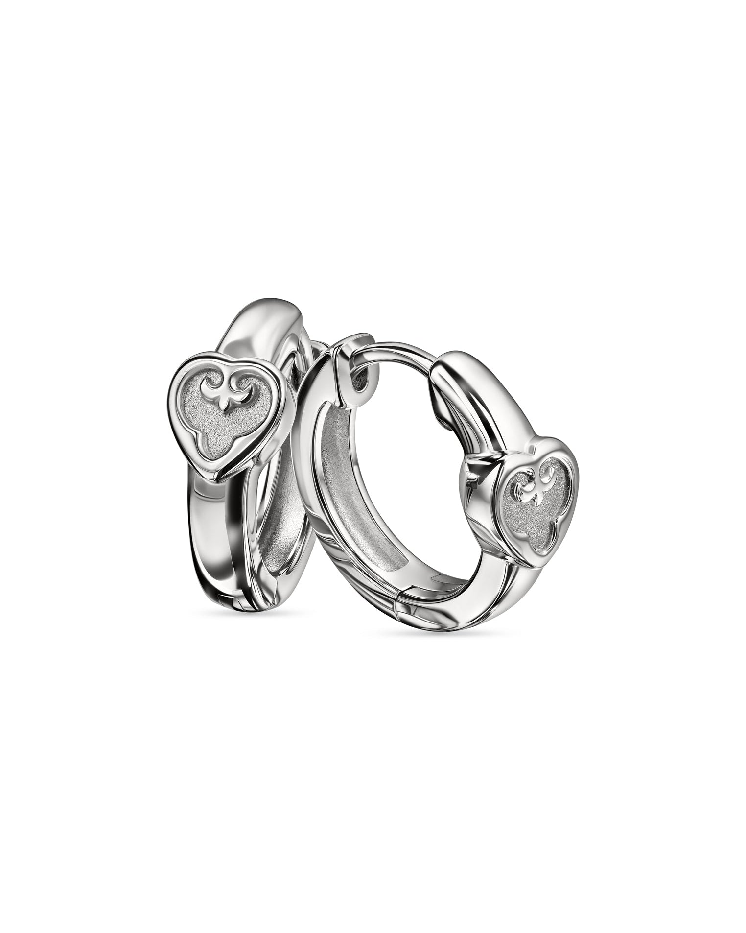 Pair of silver hoop earrings with heart designs on a white background