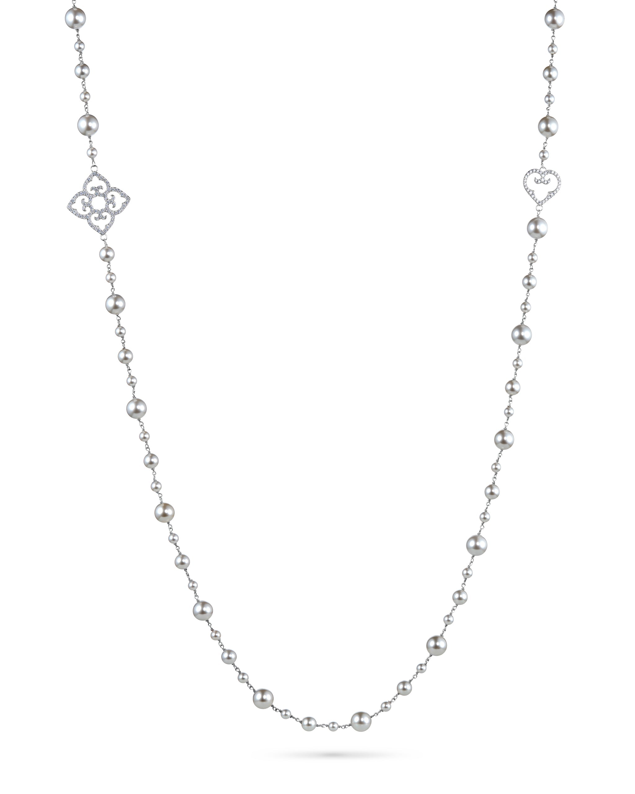 Silver necklace with heart and flower pendants on a white background