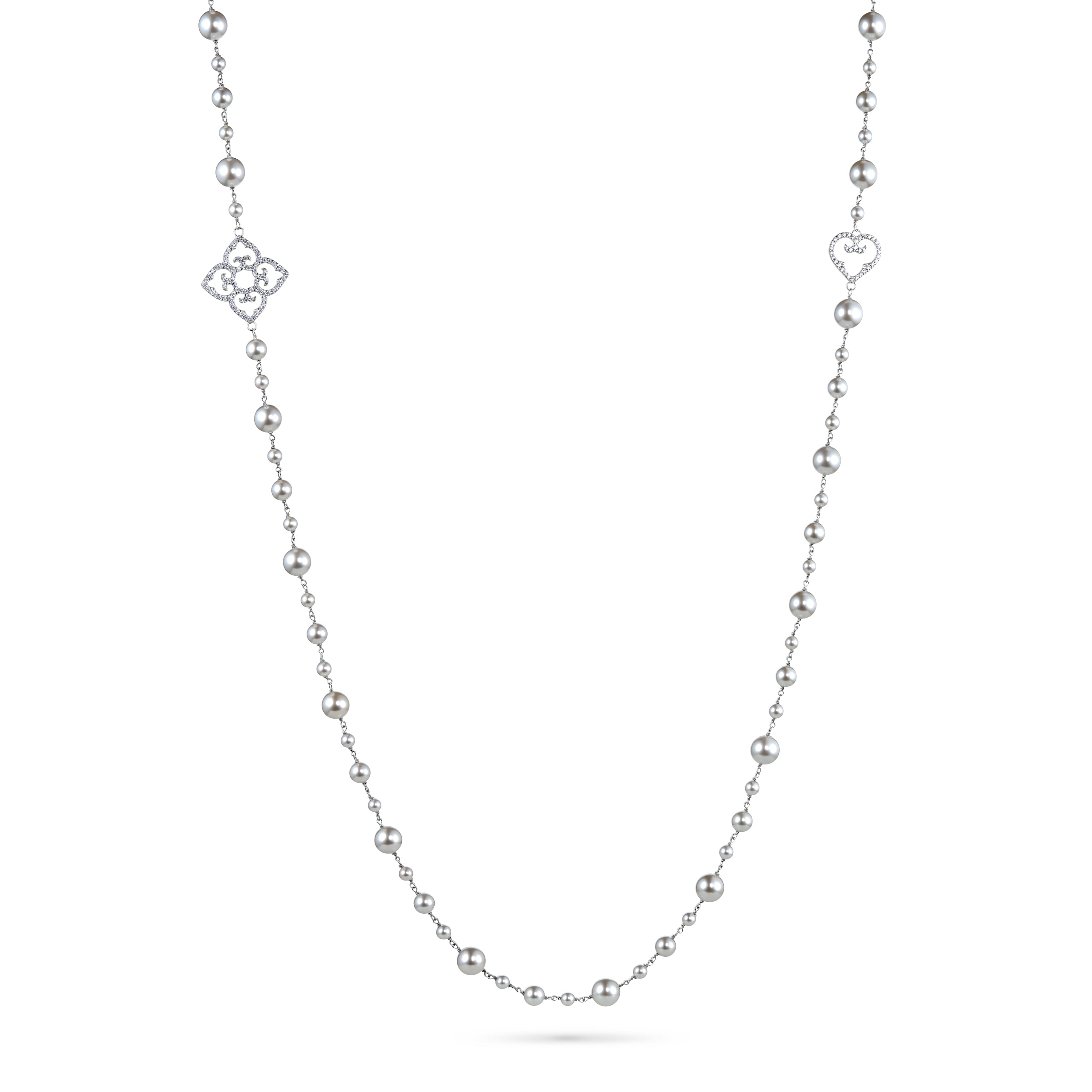 Silver necklace with heart and flower pendants on a white background