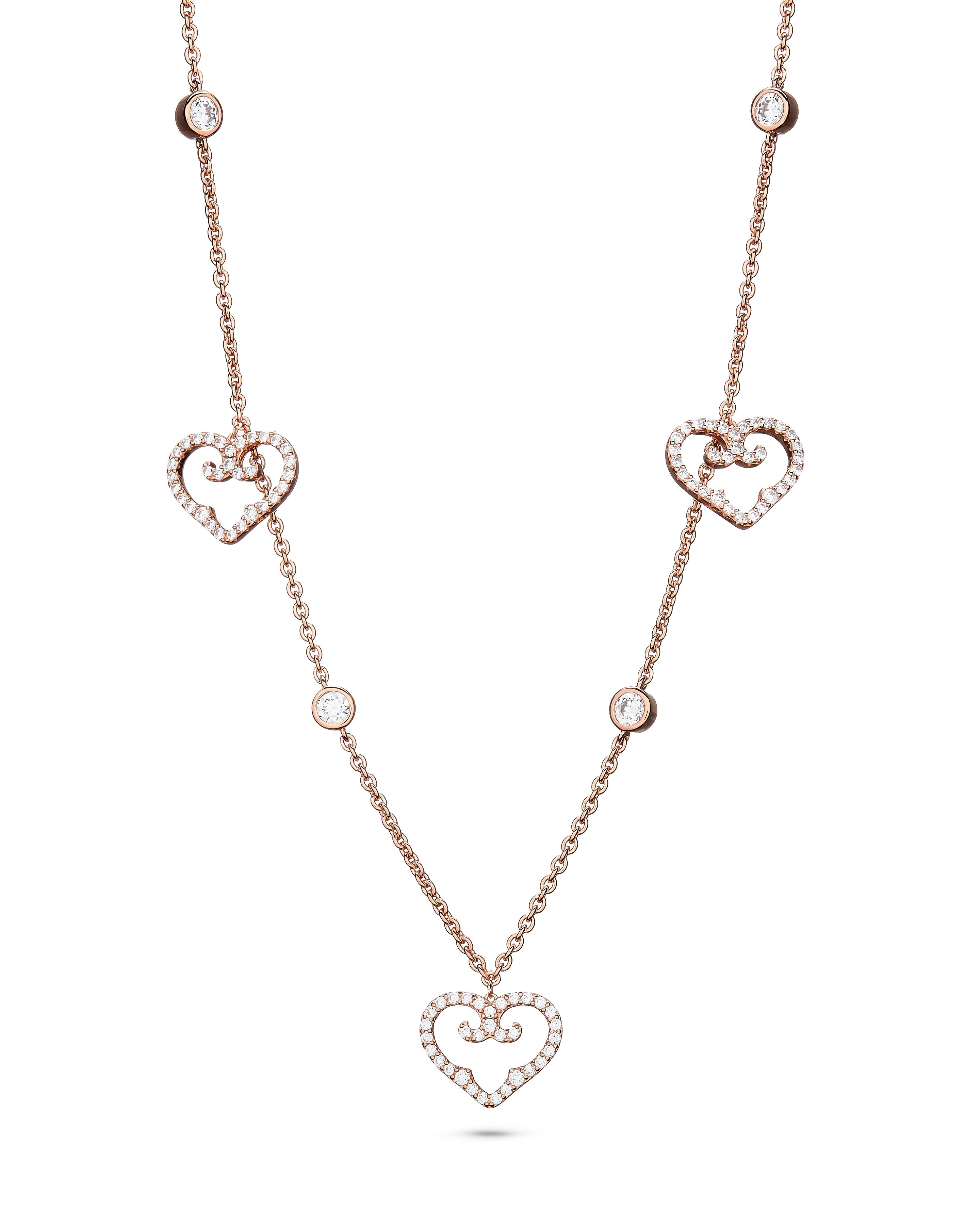 Rose gold necklace with heart-shaped pendants on a white background
