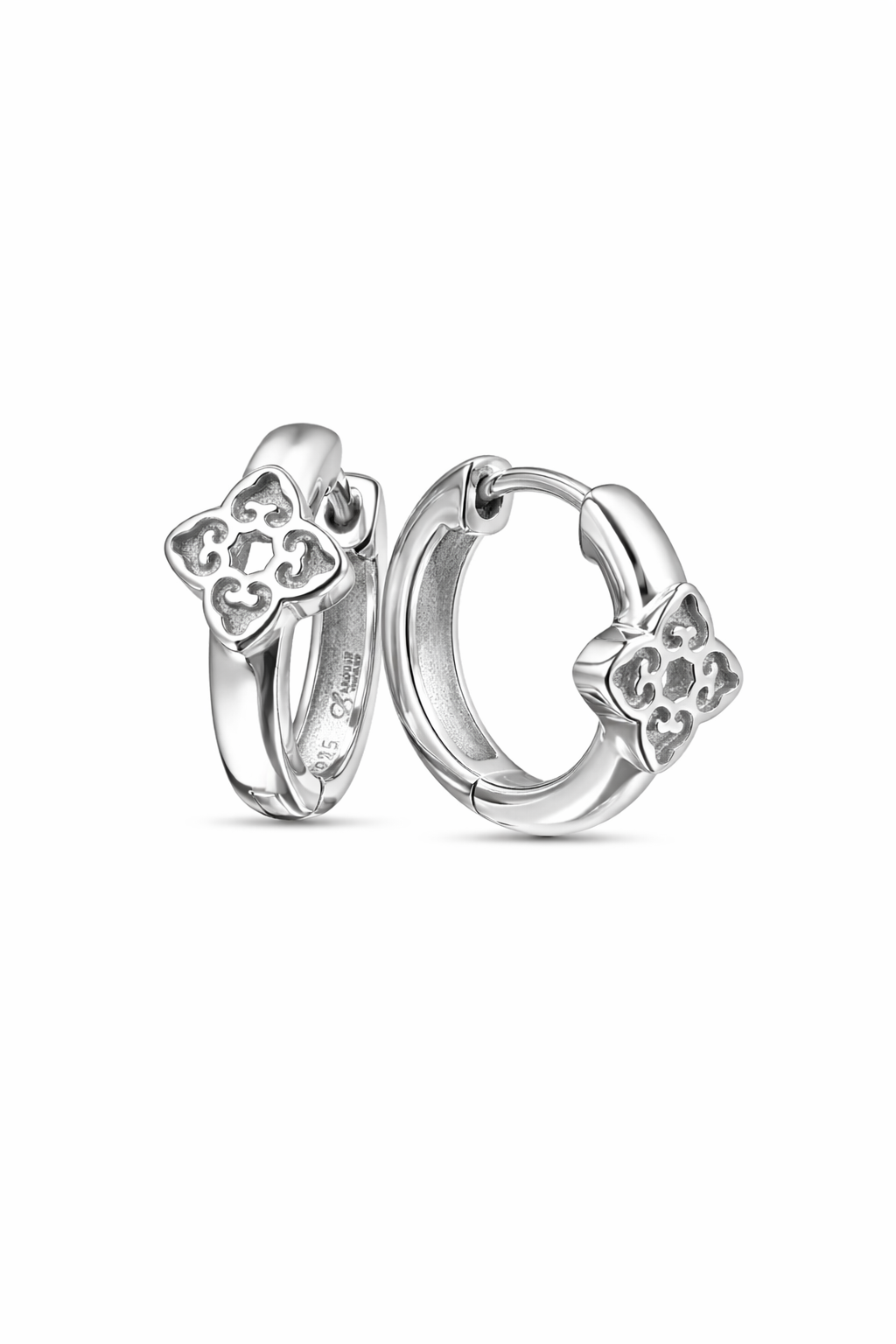 Silver hoop earrings with bow designs on a white background