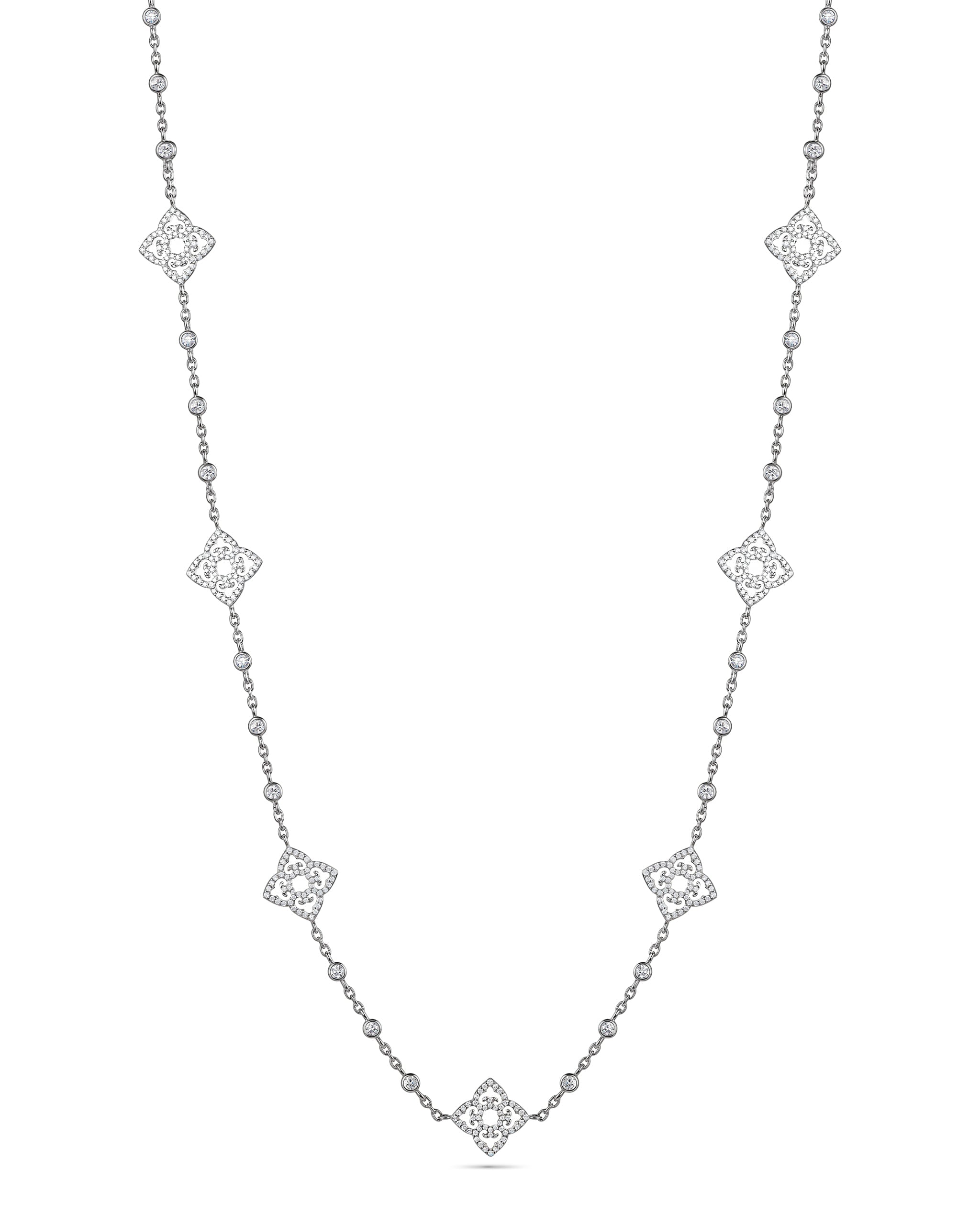 Silver necklace with diamond-like pendants on a white background