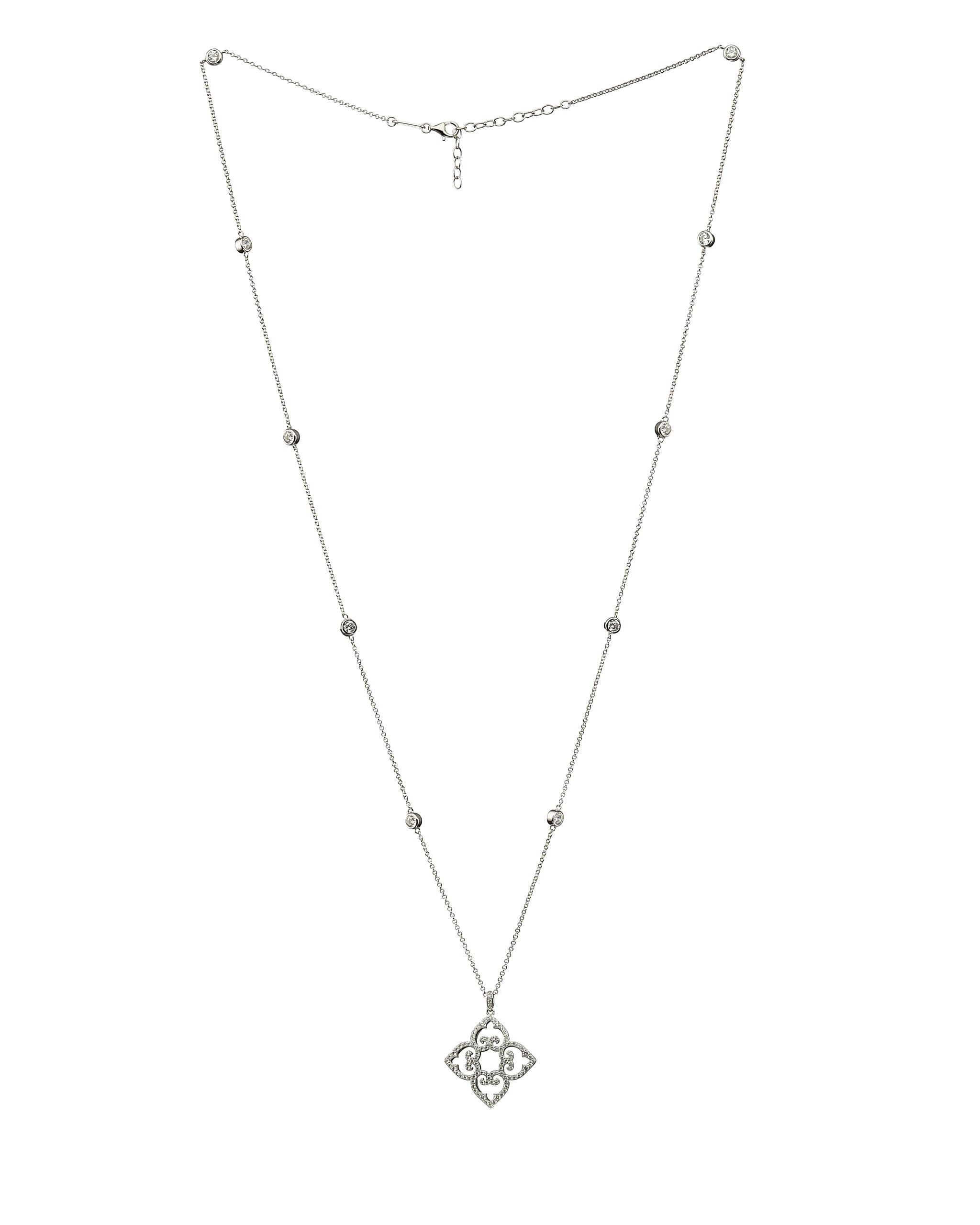 Silver necklace with a clover-shaped pendant on a white background