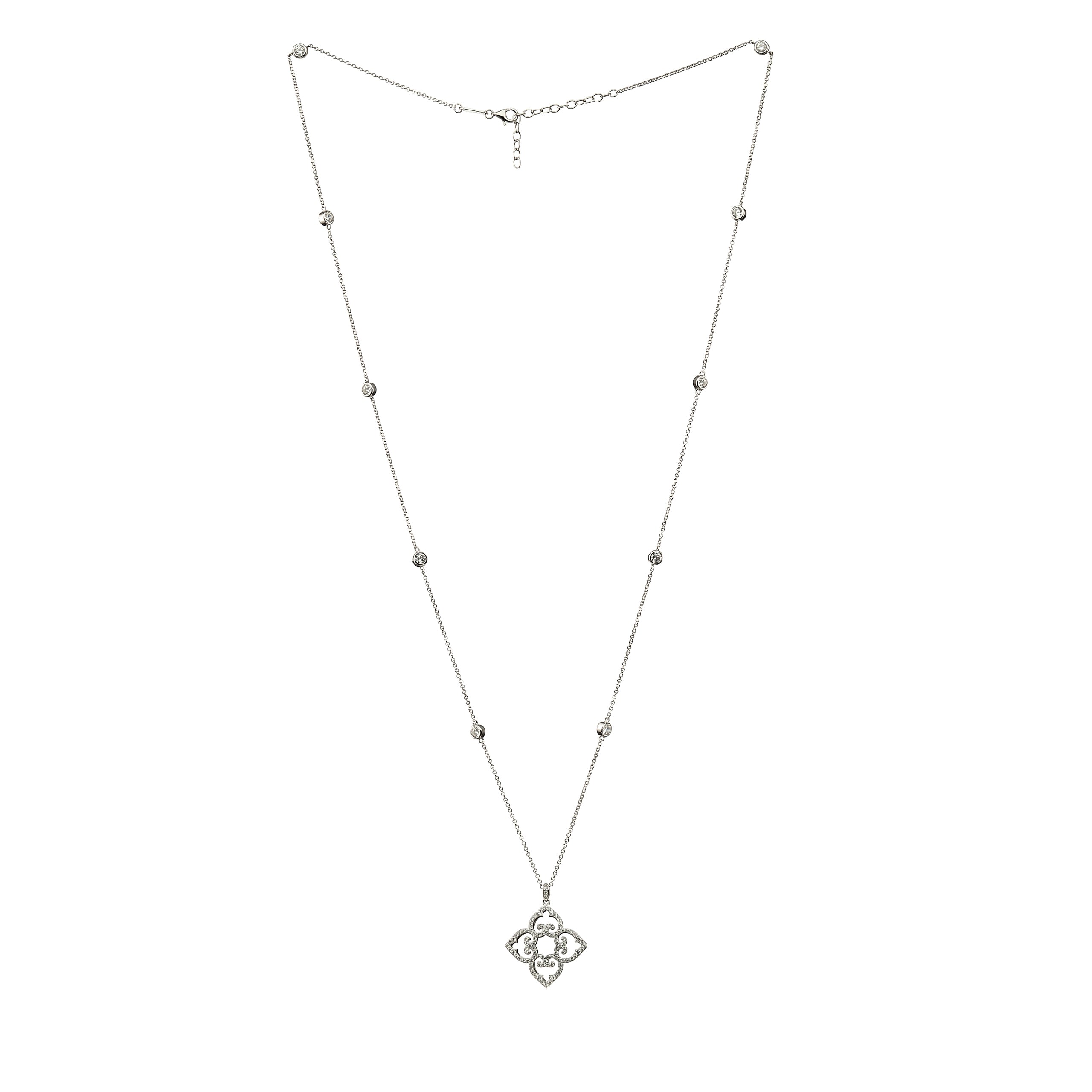 Silver necklace with a clover-shaped pendant on a white background
