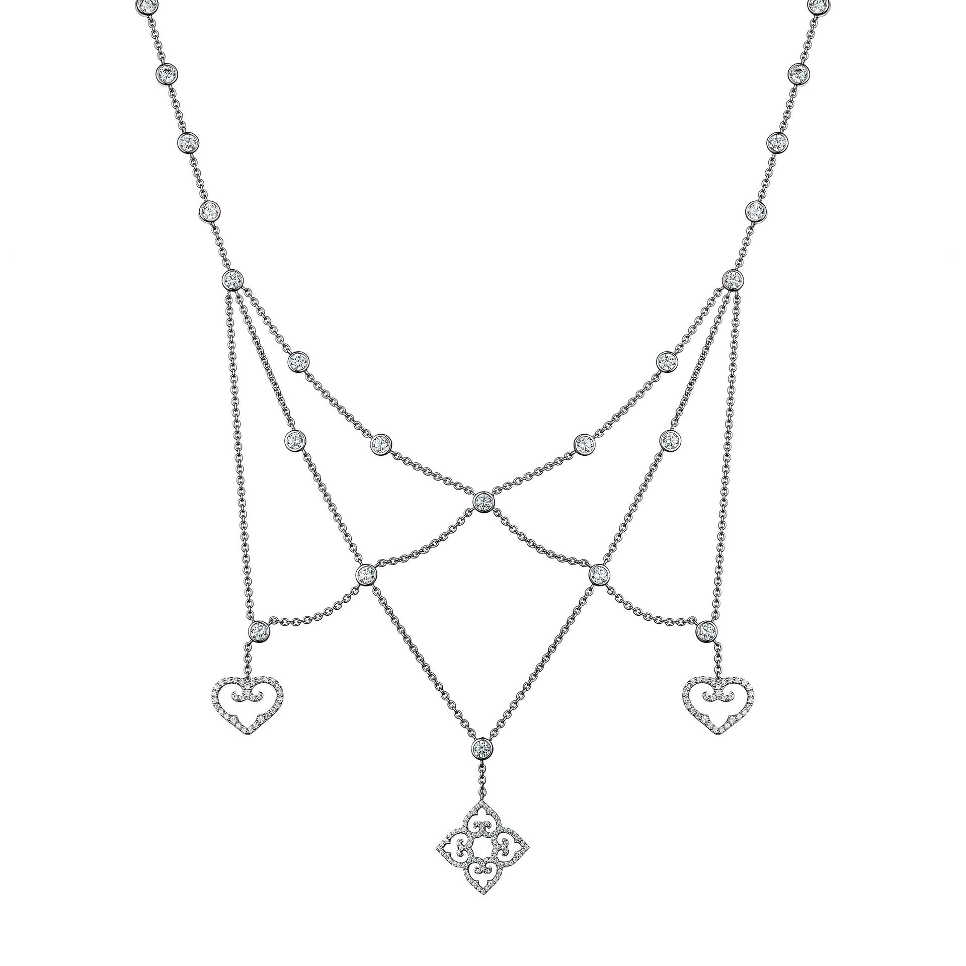 Silver necklace with heart and floral pendant on a white background