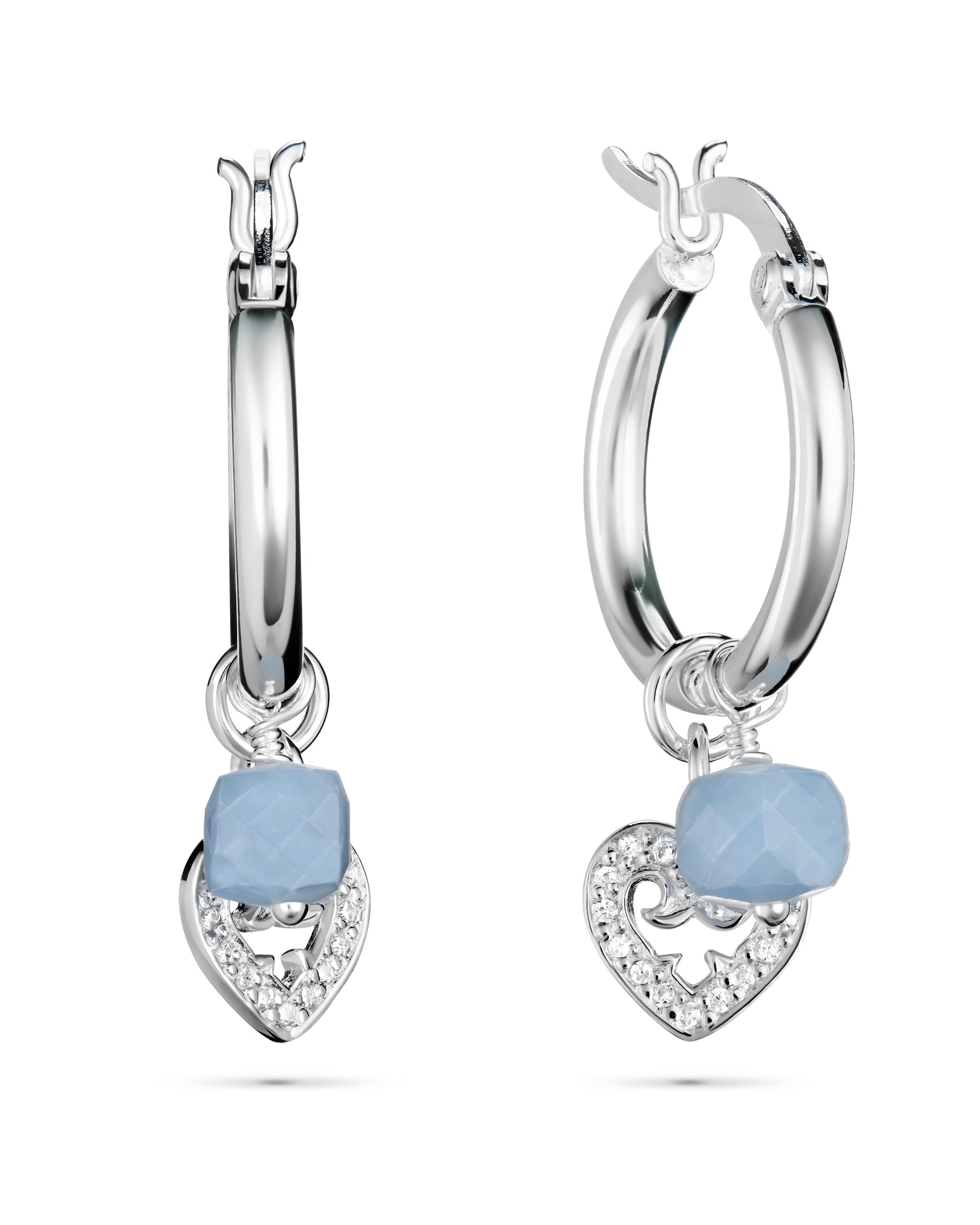 Silver hoop earrings with heart-shaped blue stones and clear gemstones on a white background