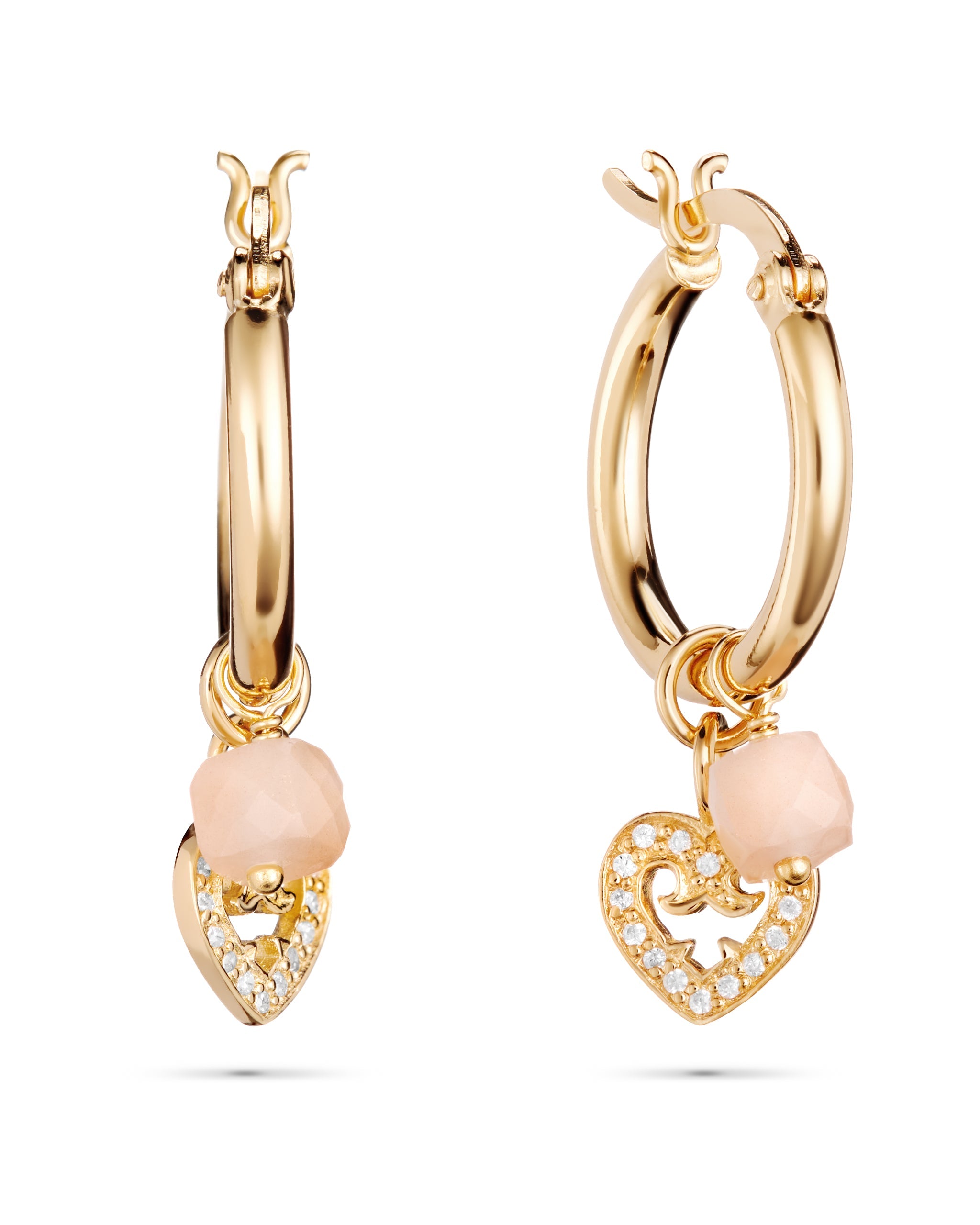 Gold hoop earrings with heart-shaped charms on a white background