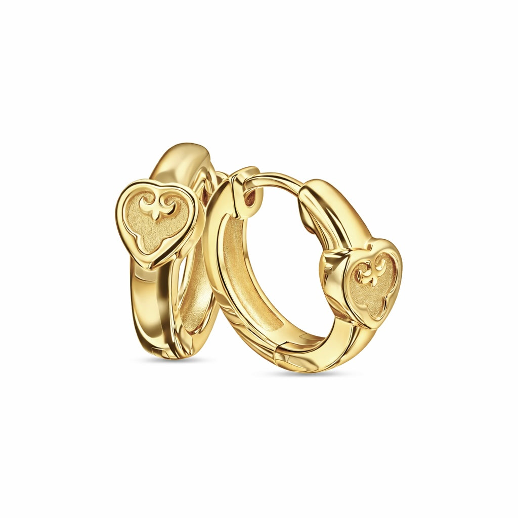 Gold hoop earrings with heart designs on a white background