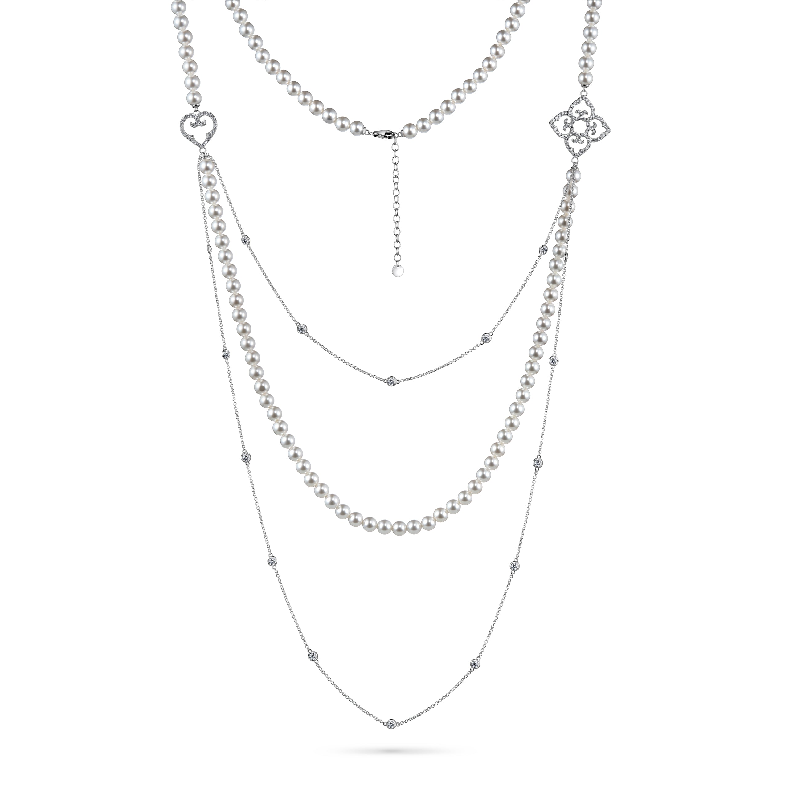 Layered silver necklace with heart and floral pendants on a white background