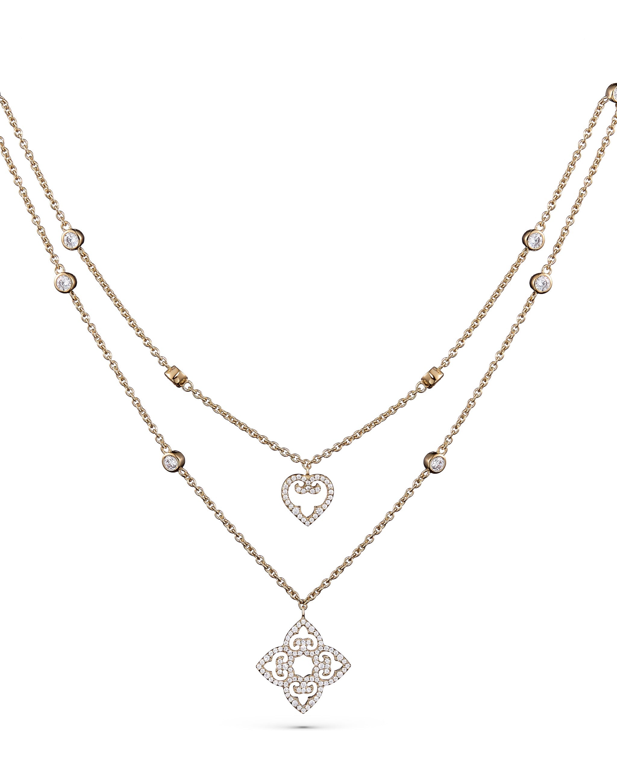 Two yellow gold necklaces with diamond pendants on a white background
