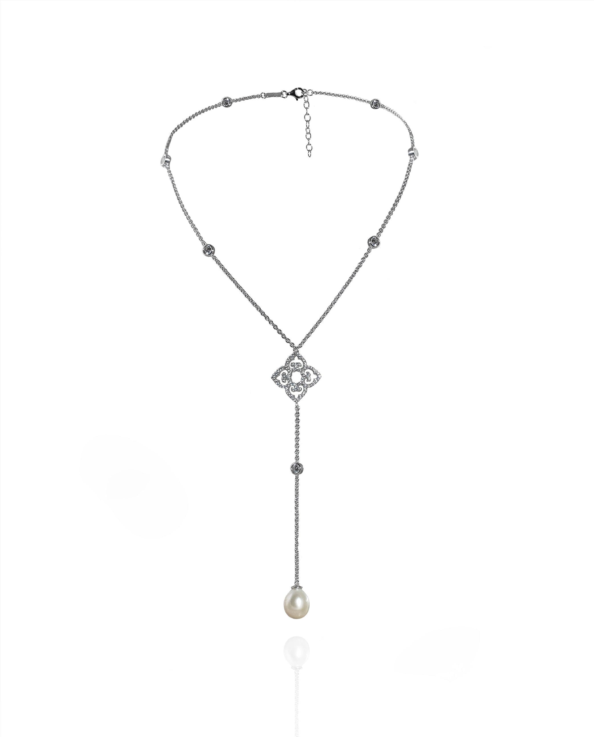 Necklace with a decorative clasp and pearl pendant on a white background