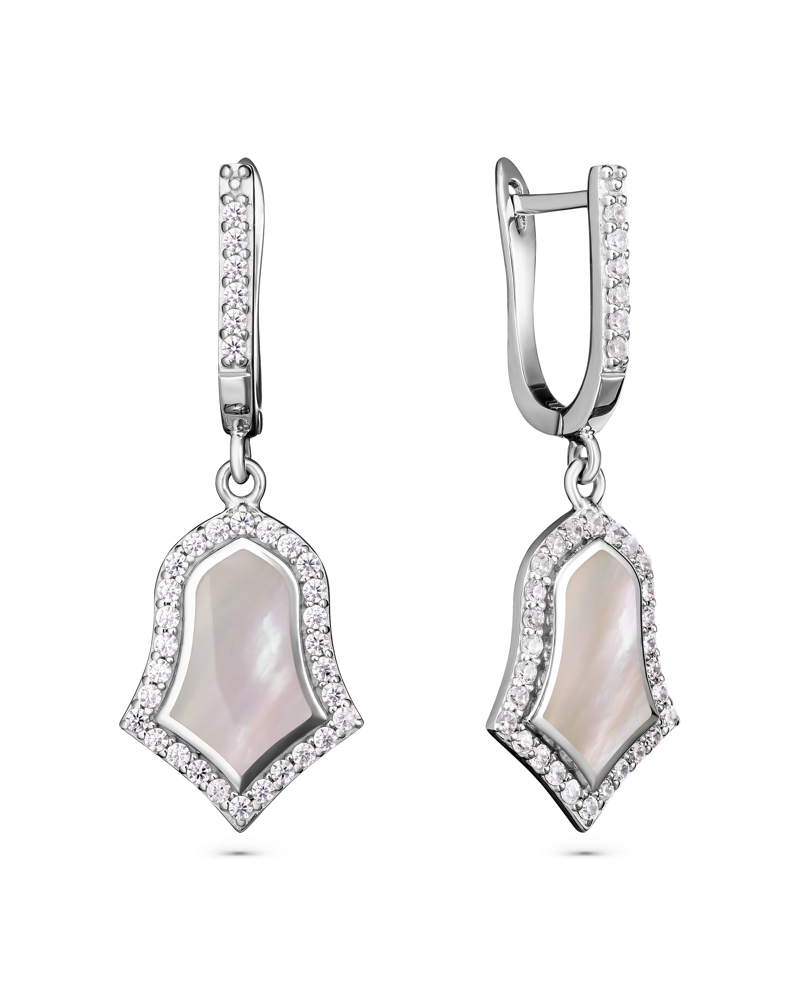 Pair of silver earrings with a central gemstone on a white background